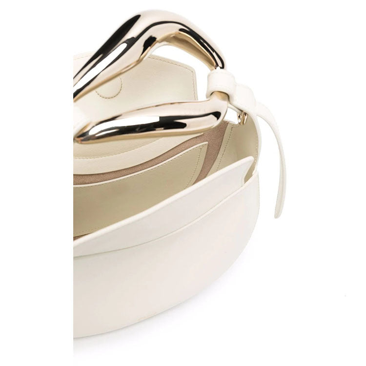 sculptural-handle saddle bag in tan leather – ARIS
