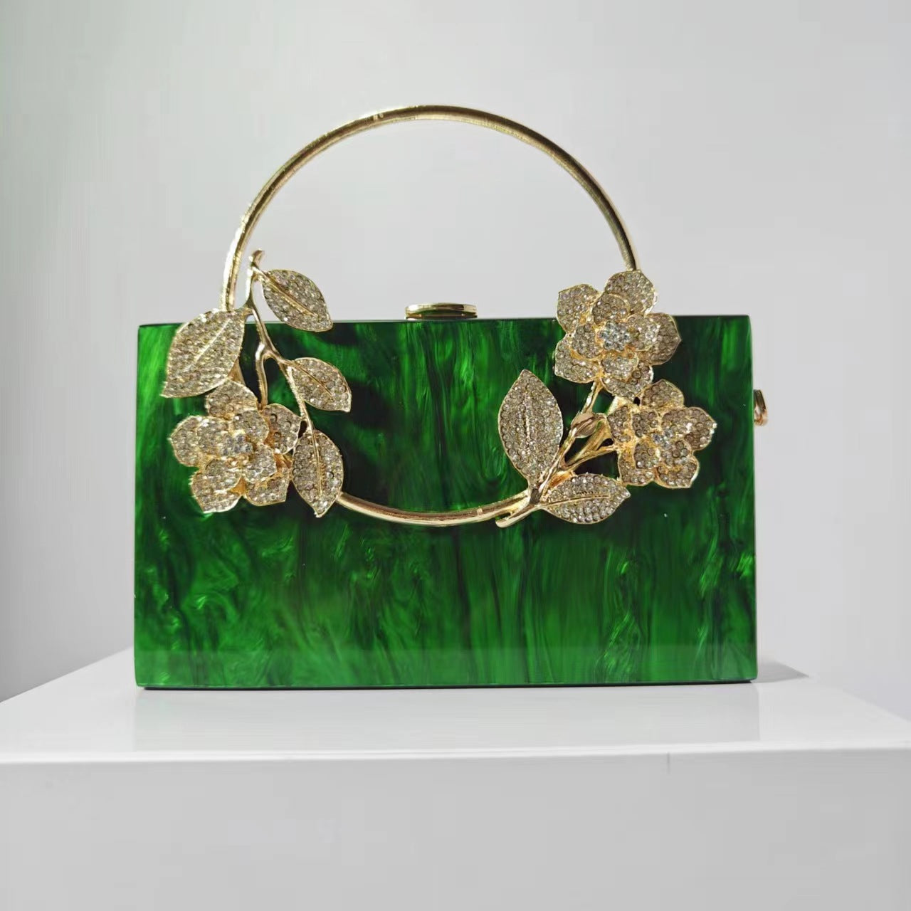 Geometric structured clutch with floral embellishments - Hirlu