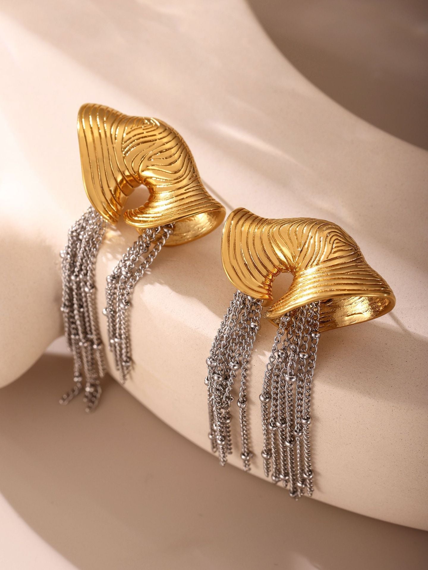 sculpted gold fan earrings with cascading chain tassels – VALINA