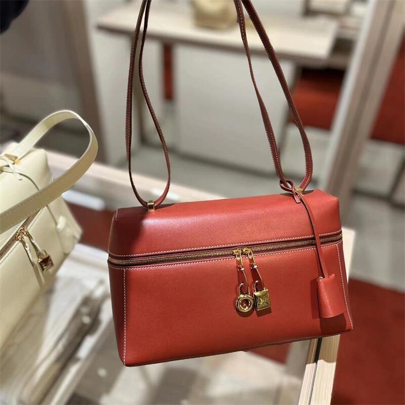 structured leather crossbody with gold lock detail – VERA