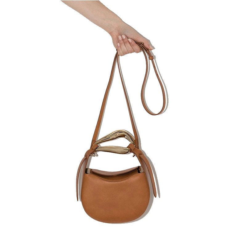 sculptural-handle saddle bag in tan leather – ARIS