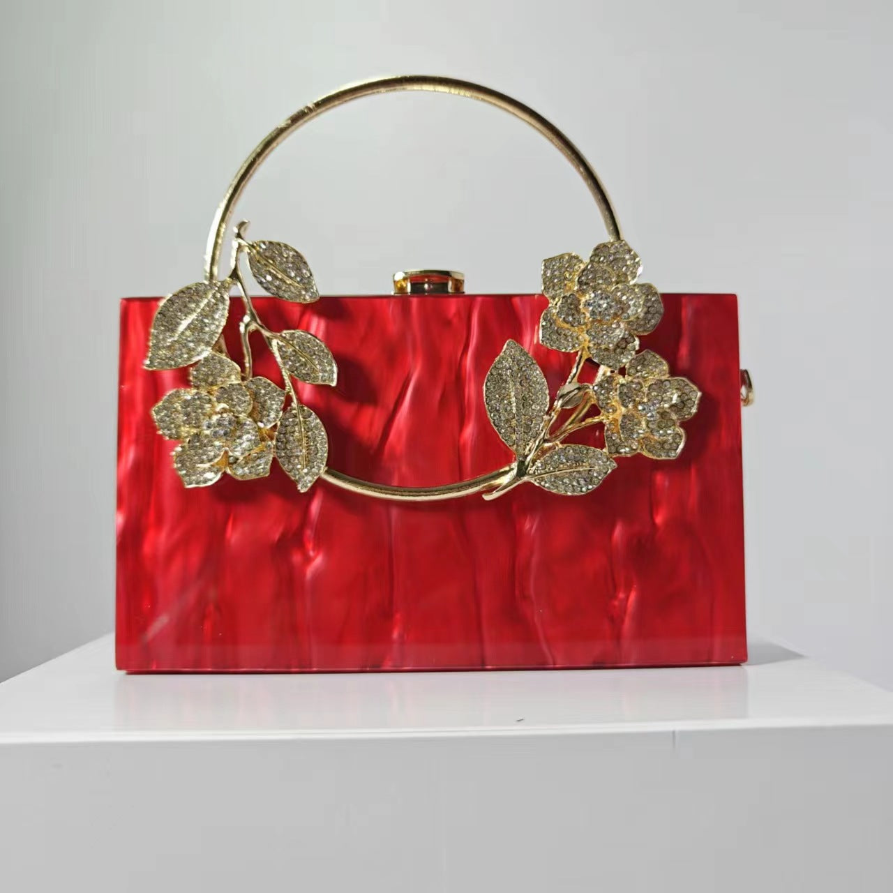 Geometric structured clutch with floral embellishments - Hirlu