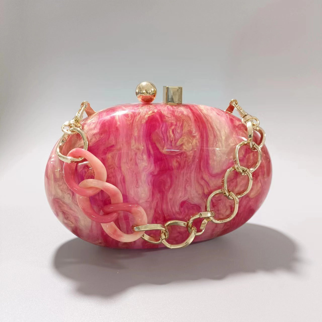 Oval marble clutch with gold clasp and chain handle - Zigru