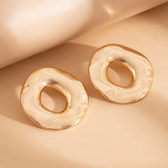 Asymmetrical hollow circle earrings with fluid surface - Nolmas