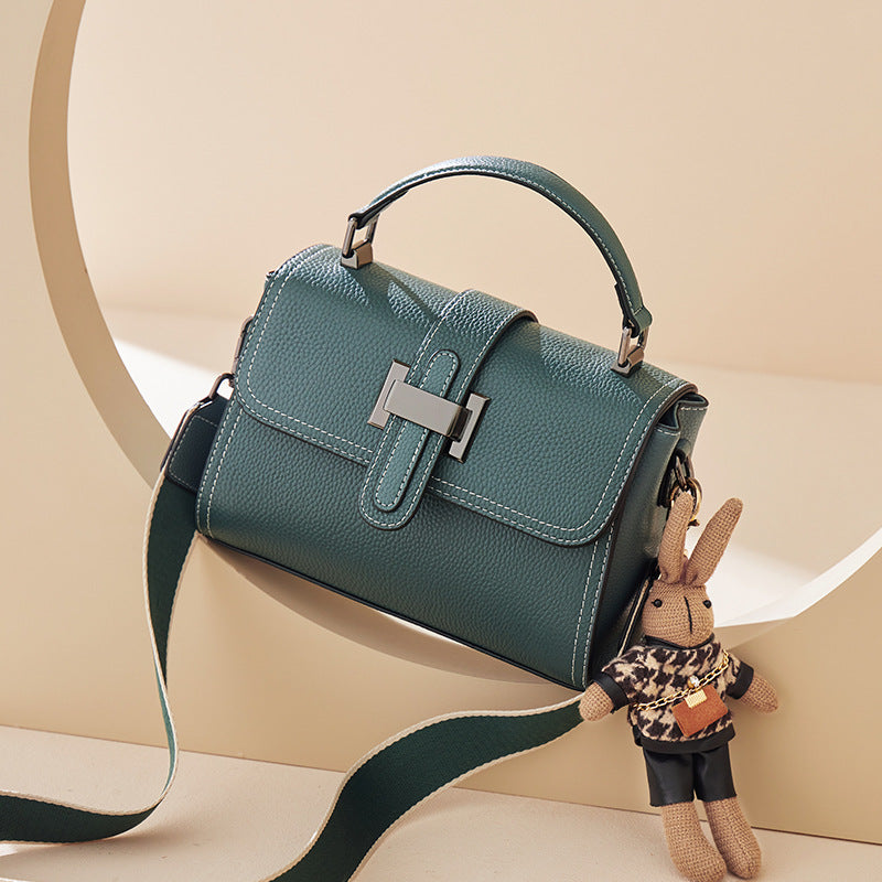 boxy leather handbag with buckle strap & bunny charm – TEAL