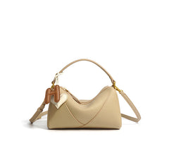 curved shoulder bag with contrast charm detail – MIIRA