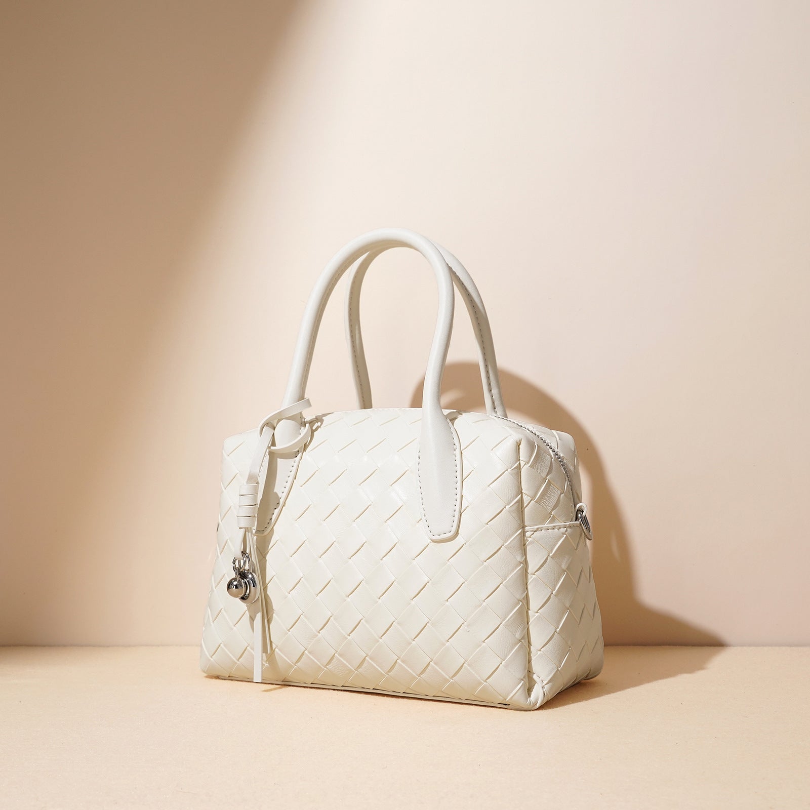 woven leather bowling bag with charm detail - ELENCA