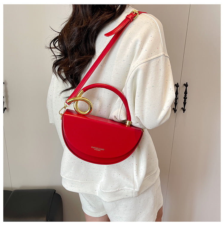 half-moon leather handbag with gold spiral handle – ORENA