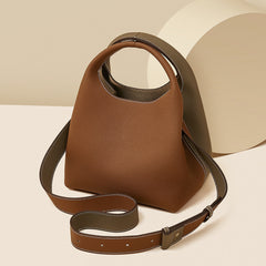 two-tone pebbled leather bucket bag with contrast strap – ARDEN