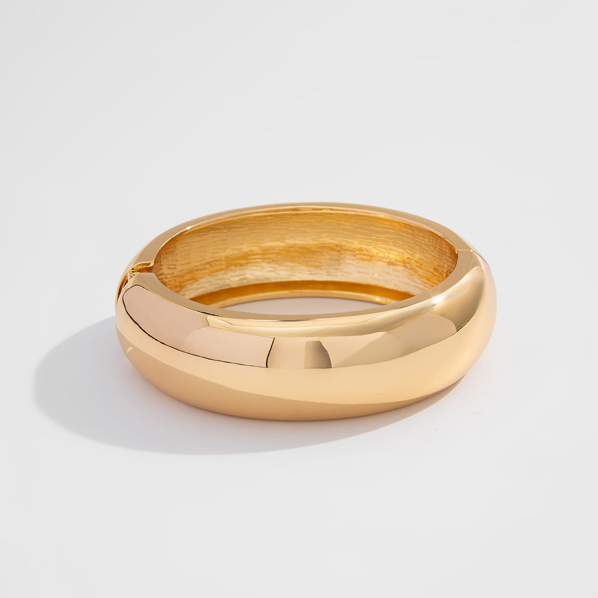 domed gold bangle bracelet with hinge clasp – ALORA