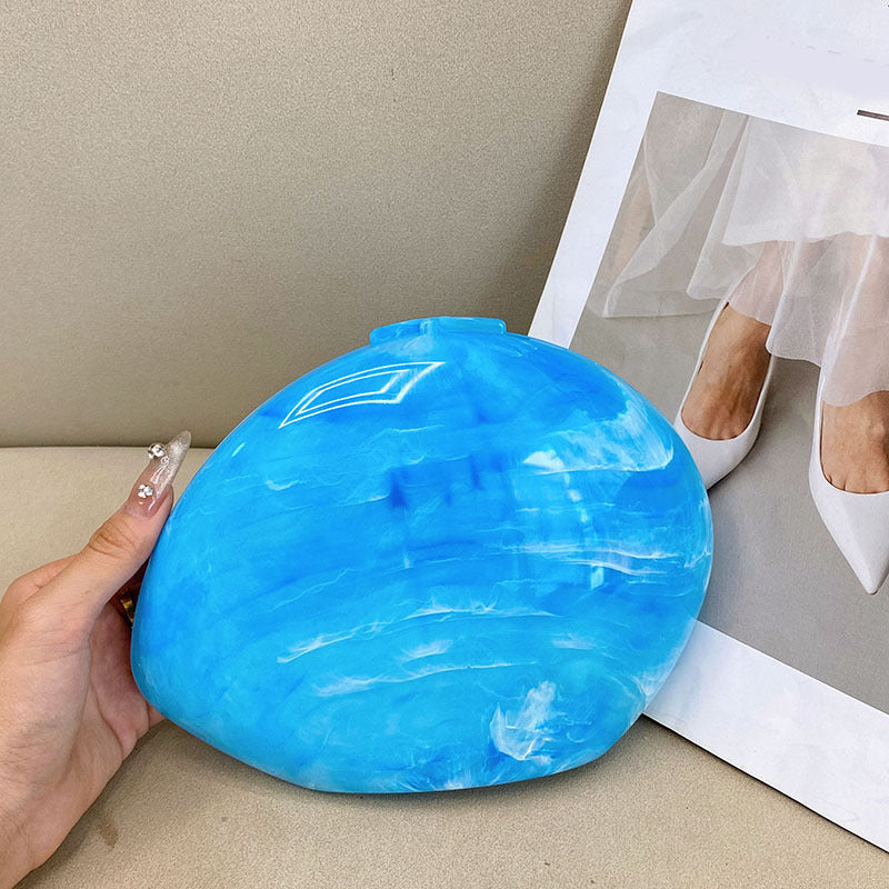 Marbled circular clutch with metallic accents - Nikru