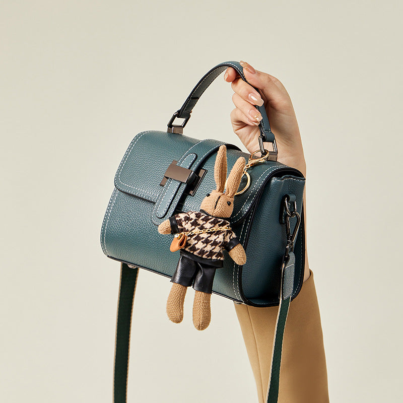 boxy leather handbag with buckle strap & bunny charm – TEAL