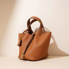 pebbled leather bucket bag with gold padlock – NOA