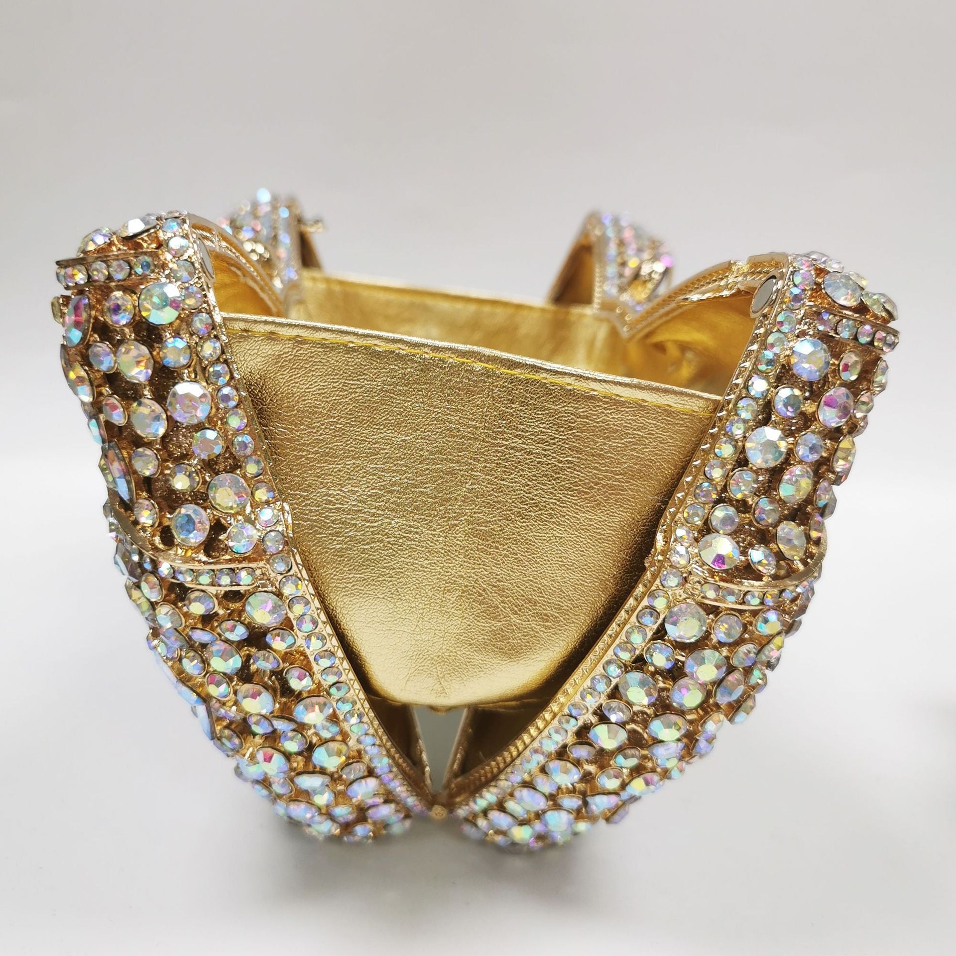 crystal bow-shaped clutch with emerald stones - Efrosini