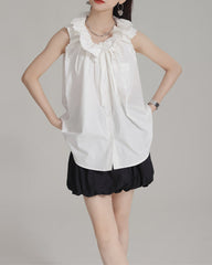 Sleeveless ruffle-collar shirt with bow detail – Endru