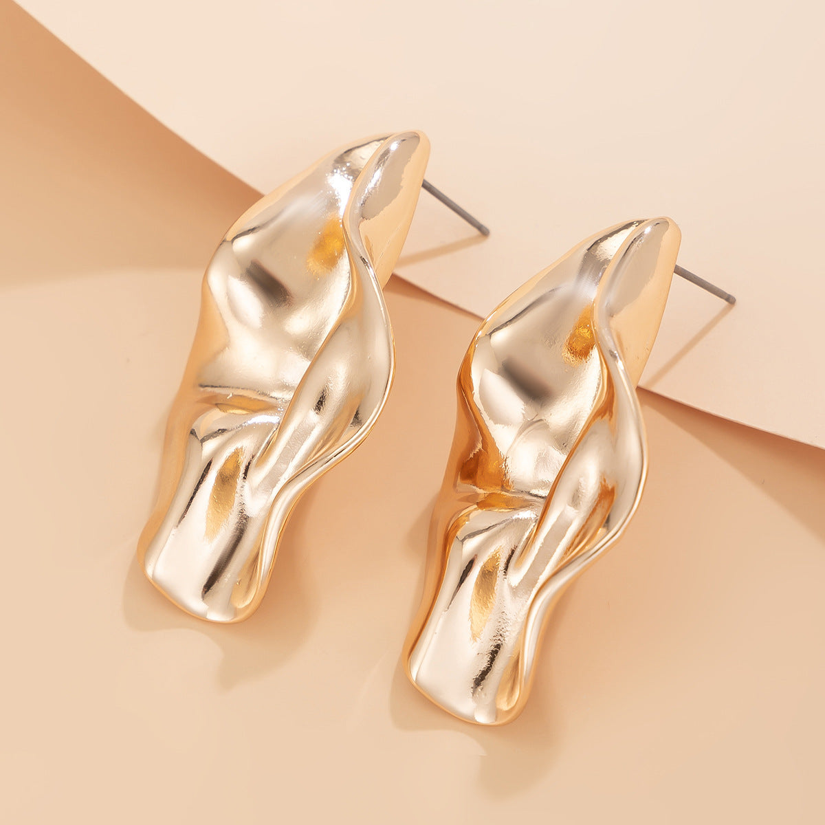 abstract sculpted stud earrings with melted metal finish - Nayam