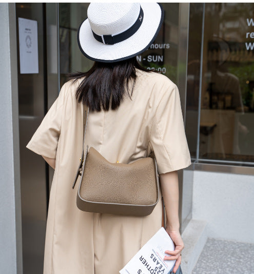 pebble leather shoulder bag with curved top - AURGA