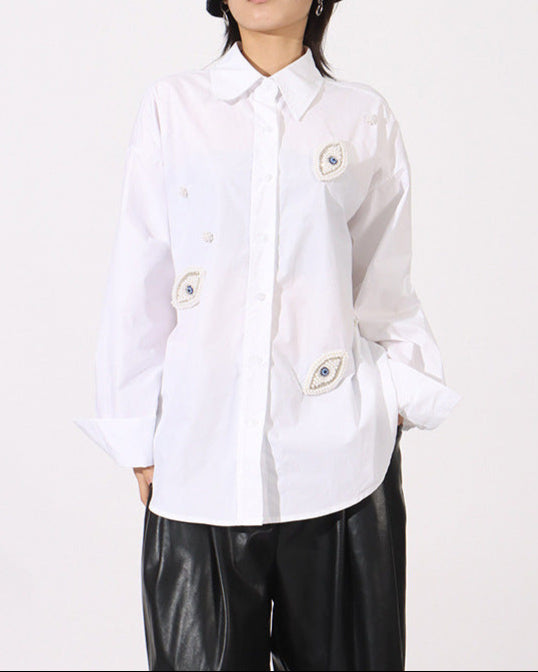 Oversized button-up shirt with embroidered eye patches - Elniru