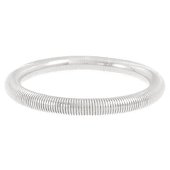 sleek coiled metal bangle with gold finish – ALVINA