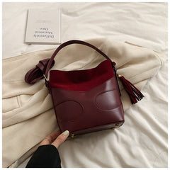 suede bucket bag with curved leather trim – RUBY
