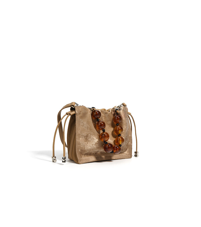 metallic drawstring shoulder bag with pearl handle – OLIVE