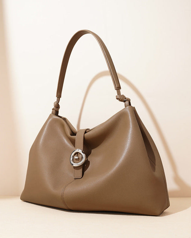 slouchy shoulder bag with circular buckle strap - CASSIAZ