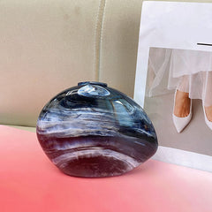 Marbled circular clutch with metallic accents - Nikru