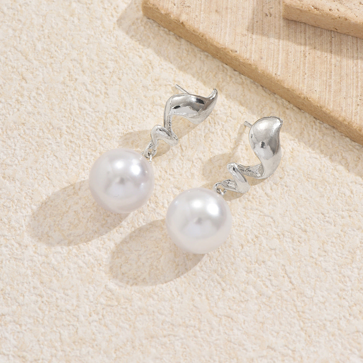 silver wave stud earrings with large pearl drops – MAELLA