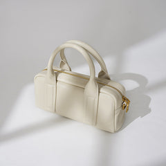 Structured top-handle handbag with bold strap detailing - LUNCA