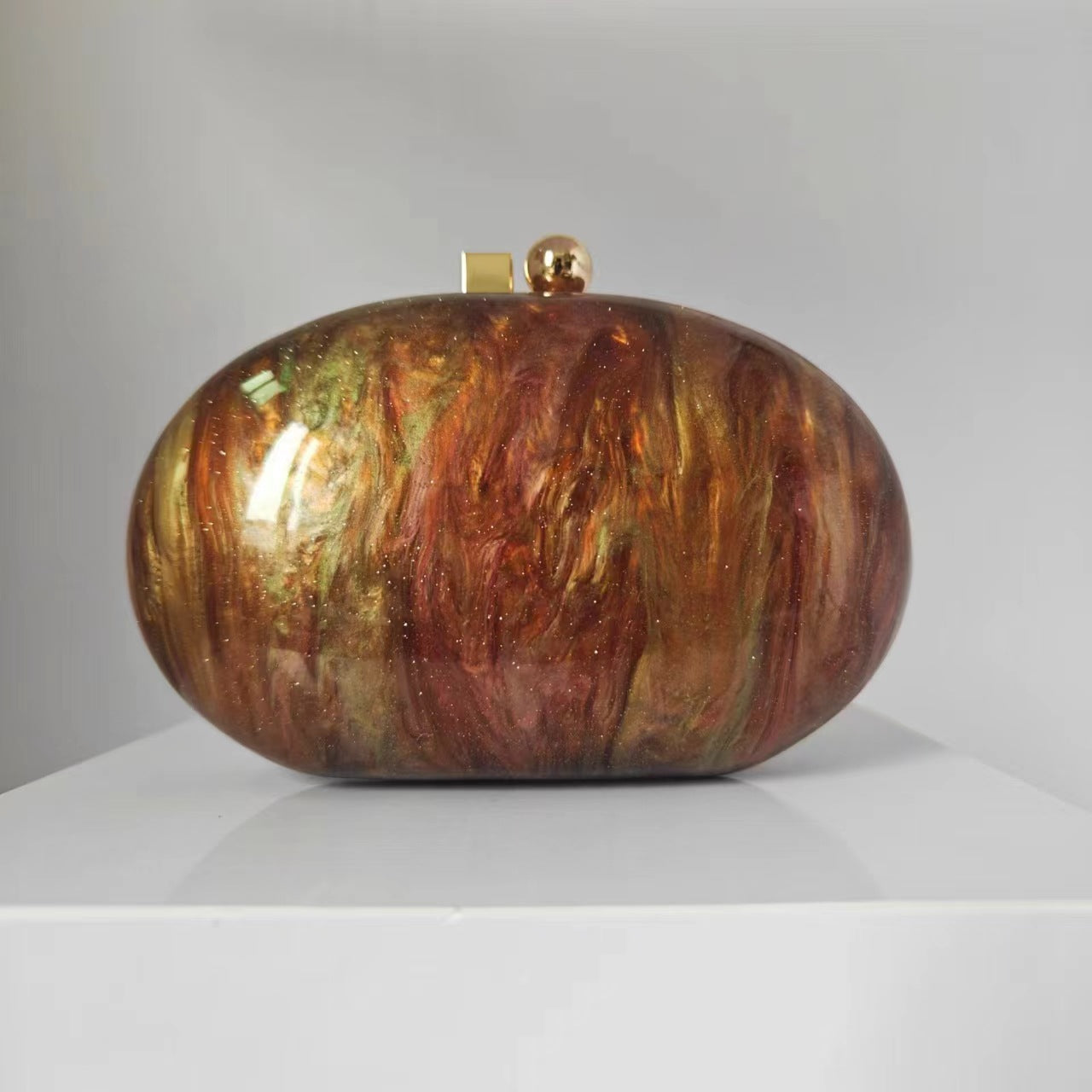 Oval marble clutch with gold clasp and chain handle - Zigru