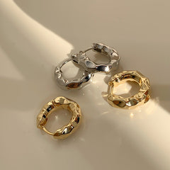 Chunky molten hoop earrings in hammered metal finish - Luxana