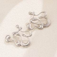 Sculptural drip-shaped earrings with statement curves – Lunimak