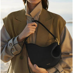 symmetrical saddle crossbody with sculpted wave – ODE