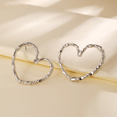 textured heart hoop earrings in matte gold – AMORA