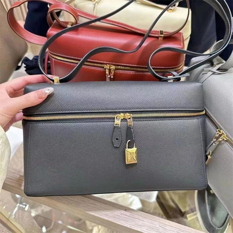 structured leather crossbody with gold lock detail – VERA