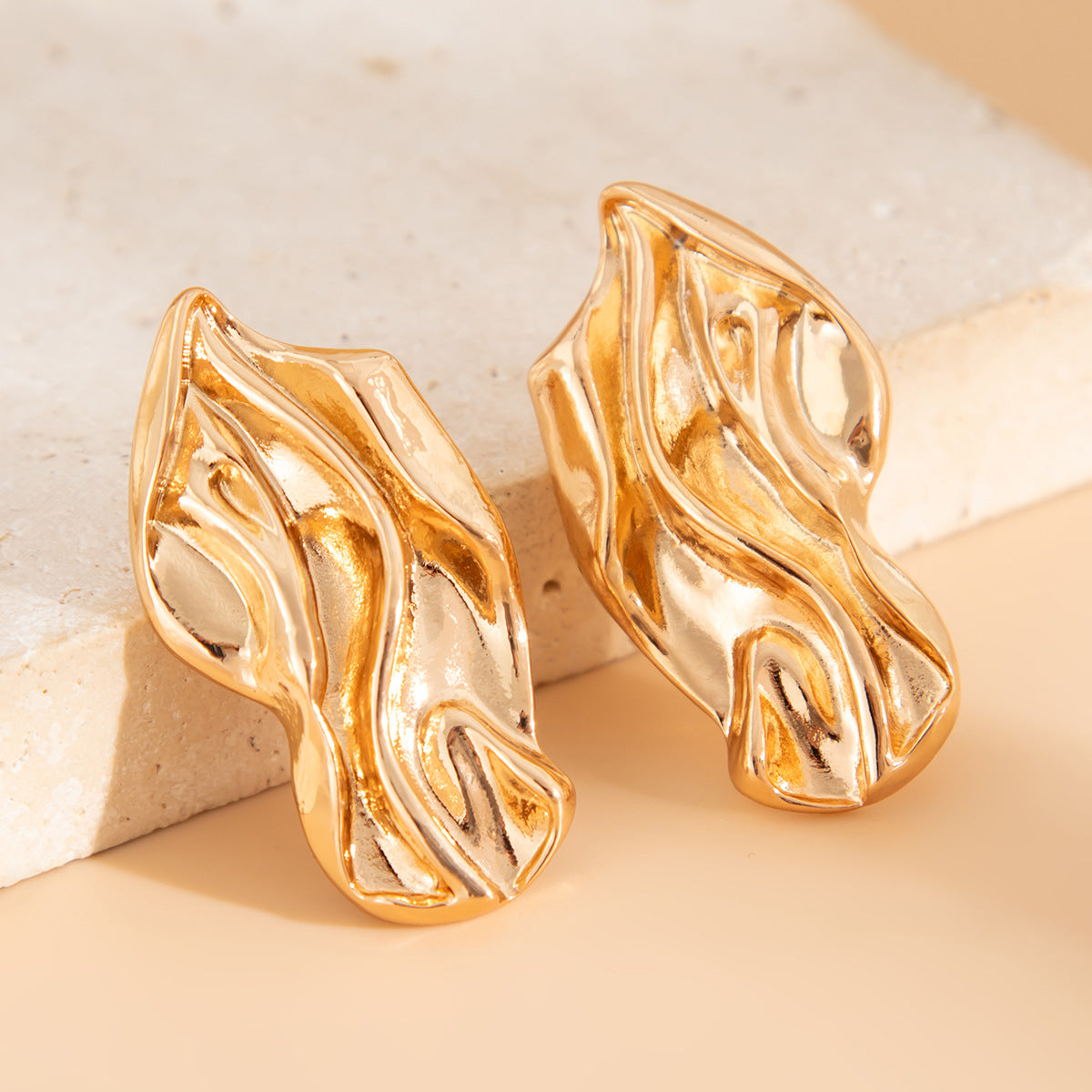 Molten wave stud earrings with organic contours - Roni