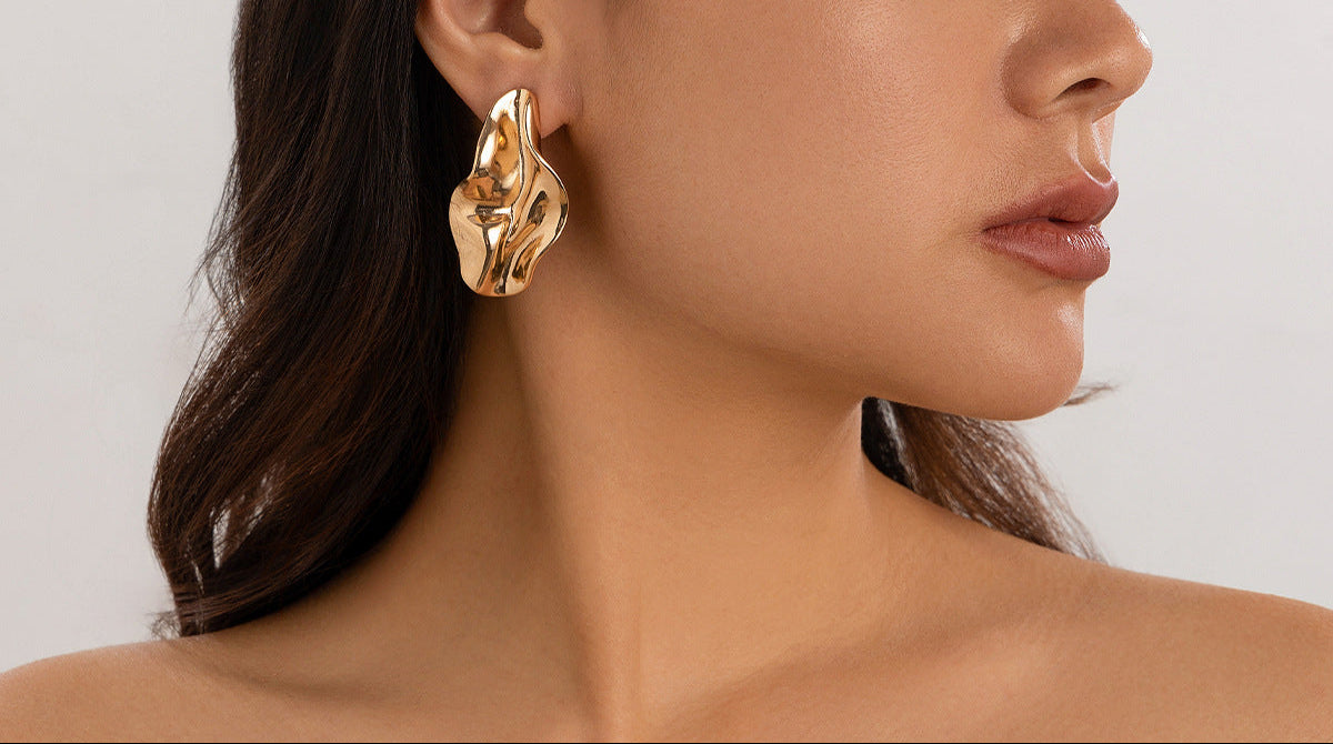 abstract sculpted stud earrings with melted metal finish - Nayam