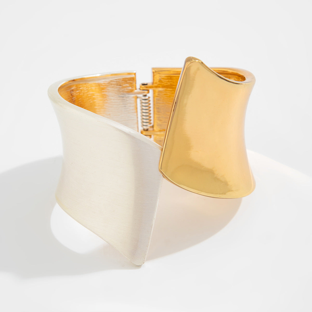 Two-tone wide cuff bracelet with sculptural twist - Nesdu