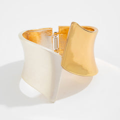 Two-tone wide cuff bracelet with sculptural twist - Nesdu