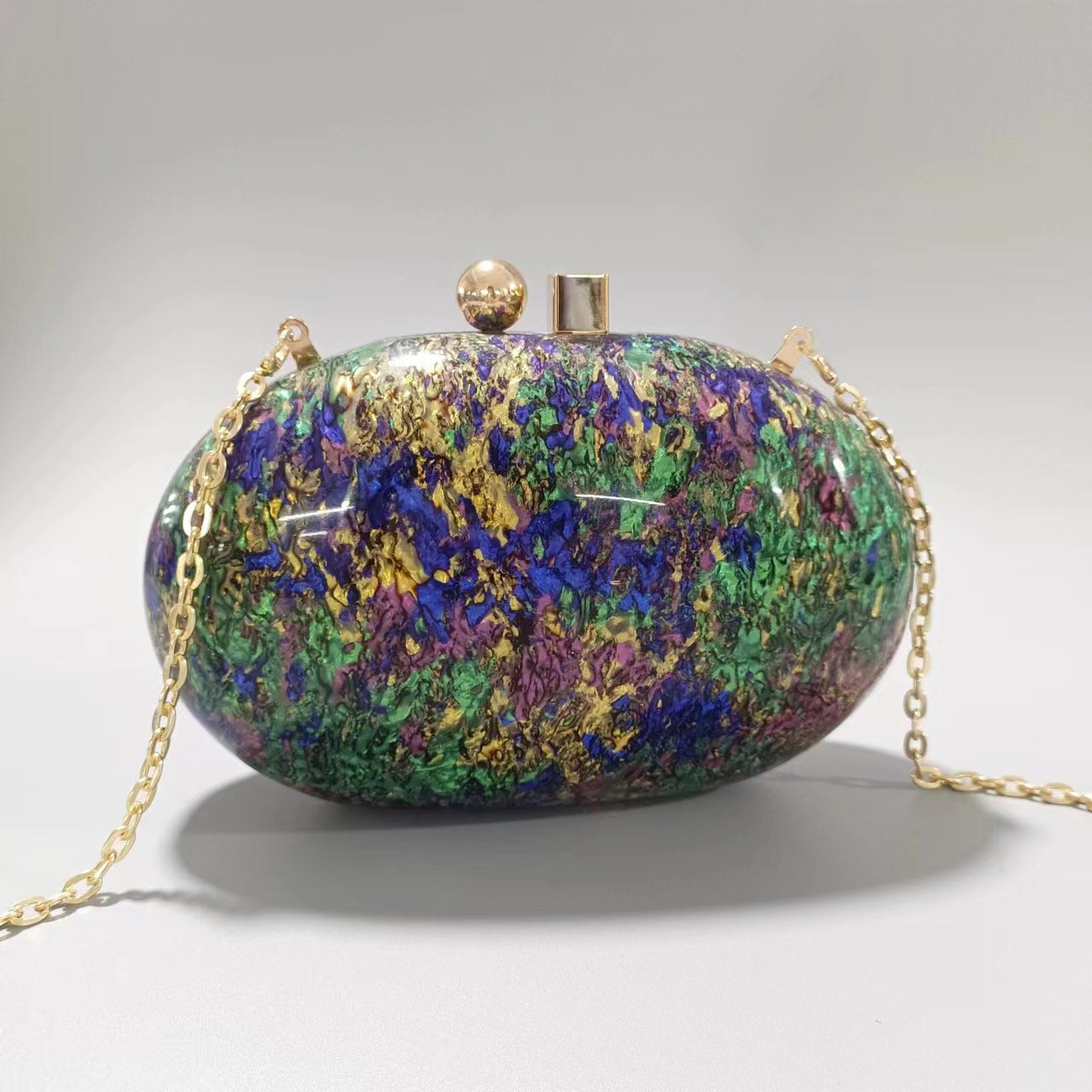 Oval marble clutch with gold clasp and chain handle - Zigru