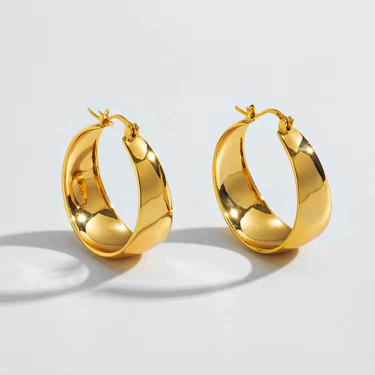 wide sculpted hoop earrings with polished finish - Solan