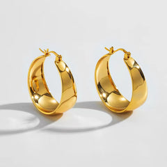 wide sculpted hoop earrings with polished finish - Solan