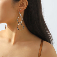 sculptural twist drop earrings – LUXA