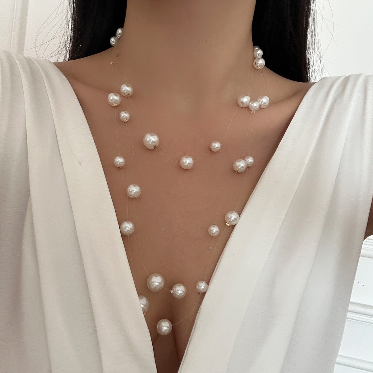 floating pearl strand necklace with layered illusion threads – AUIRO