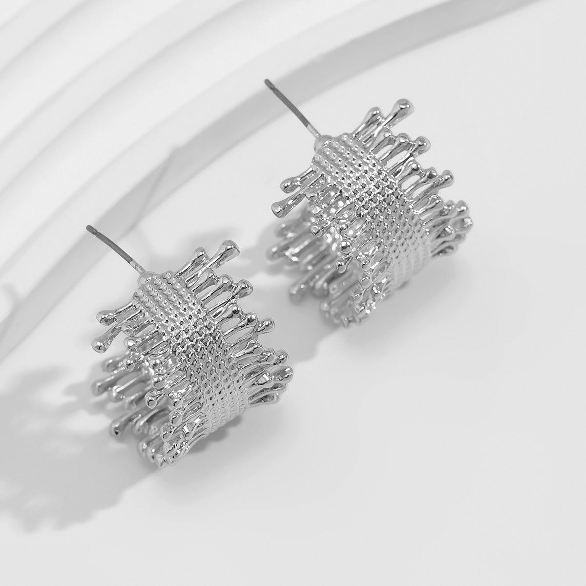 Textured woven hoop earrings with abstract tips – Nasdol