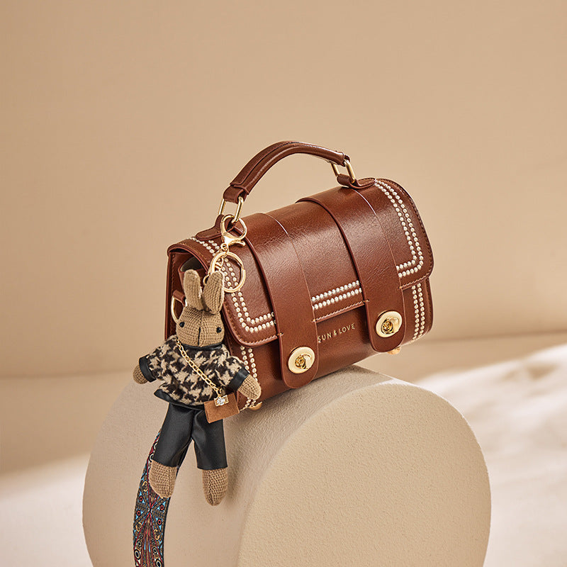 pearl-trim leather satchel with double clasp & bunny charm – COCOA