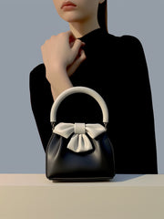 Bow-embellished handbag with round handle - Sikry