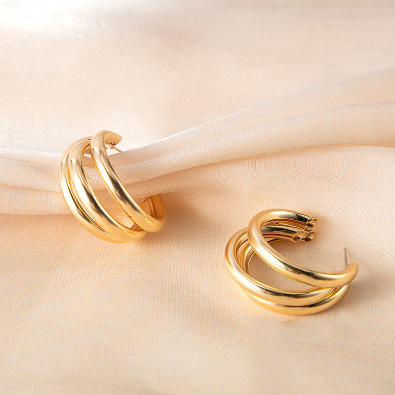 Double dome hoop earrings in polished gold – Vintuki
