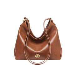 slouchy leather shoulder bag with gold emblem – AURX