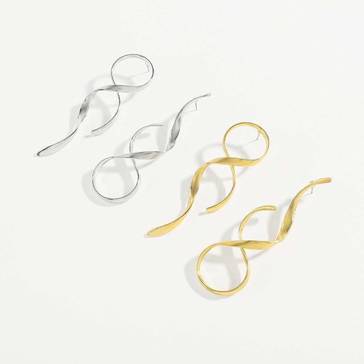 sculptural twist drop earrings – LUXA